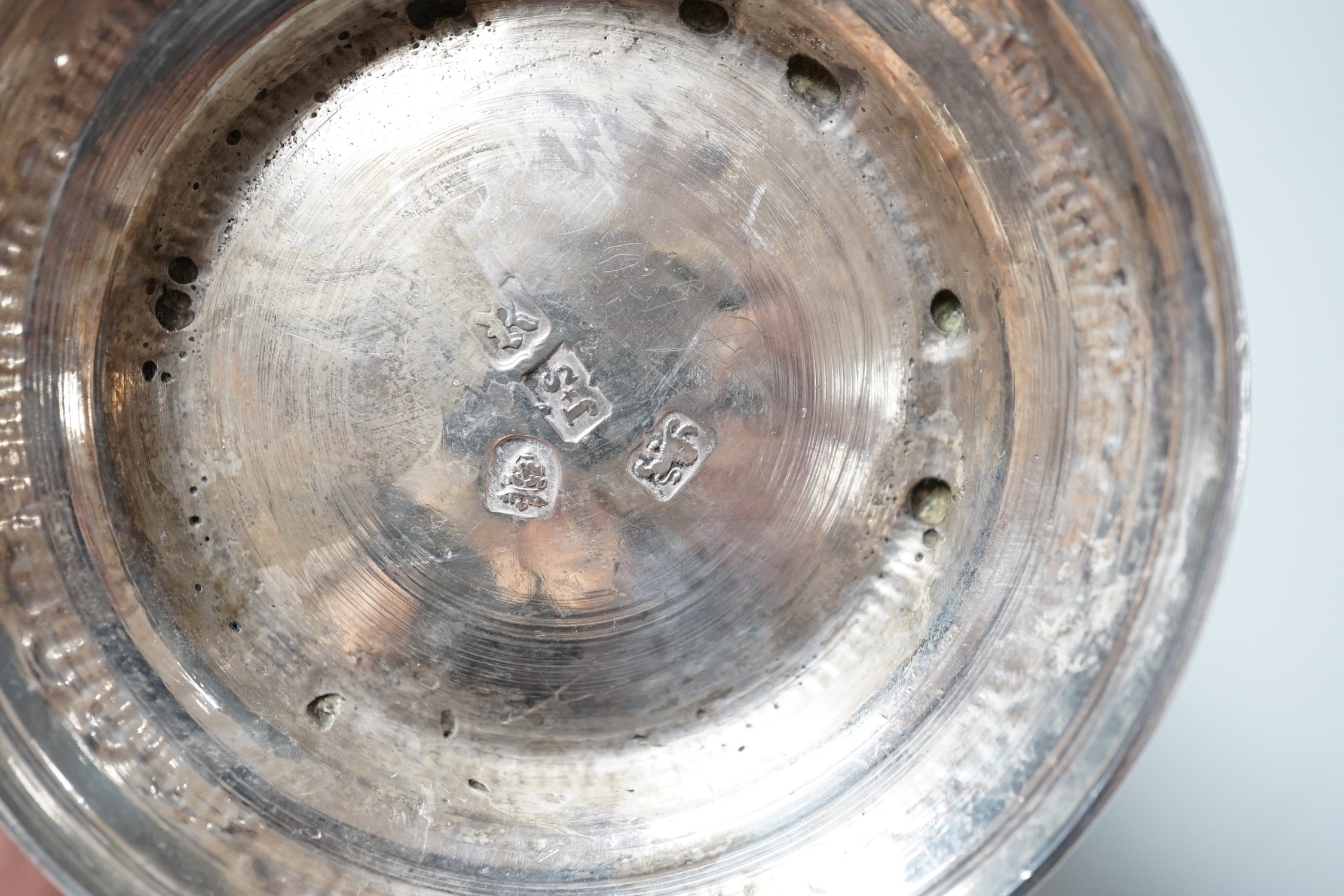 A George III silver mug, with late embossed decoration, John Scofield, 1772, 11.7cm, 9.9oz.